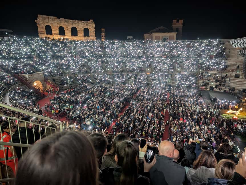 Verona: Arena di Verona Opera Ticket - Inside the Arena: stone steps, subtitle screens, and the real sound